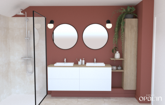Conception de salle de bains moderne à Angers avec meuble double vasque suspendu blanc et grands miroirs donds sur mur terracotta.